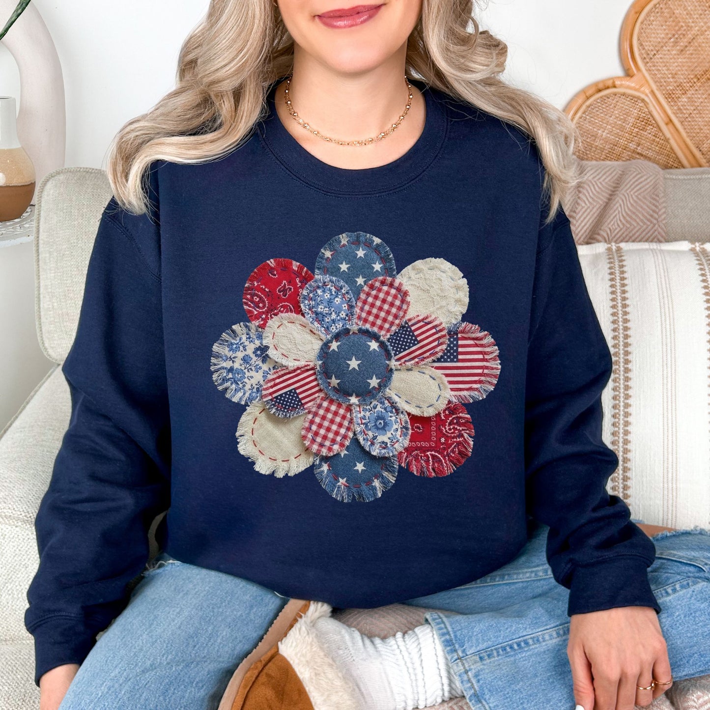 "Patriotic Patchwork Flower" graphic on dark blue (navy) sweatshirt.