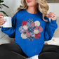 "Patriotic Patchwork Flower" graphic on bright medium blue (royal blue) sweatshirt.