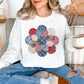 "Patriotic Patchwork Flower" graphic on bright white (white) sweatshirt.