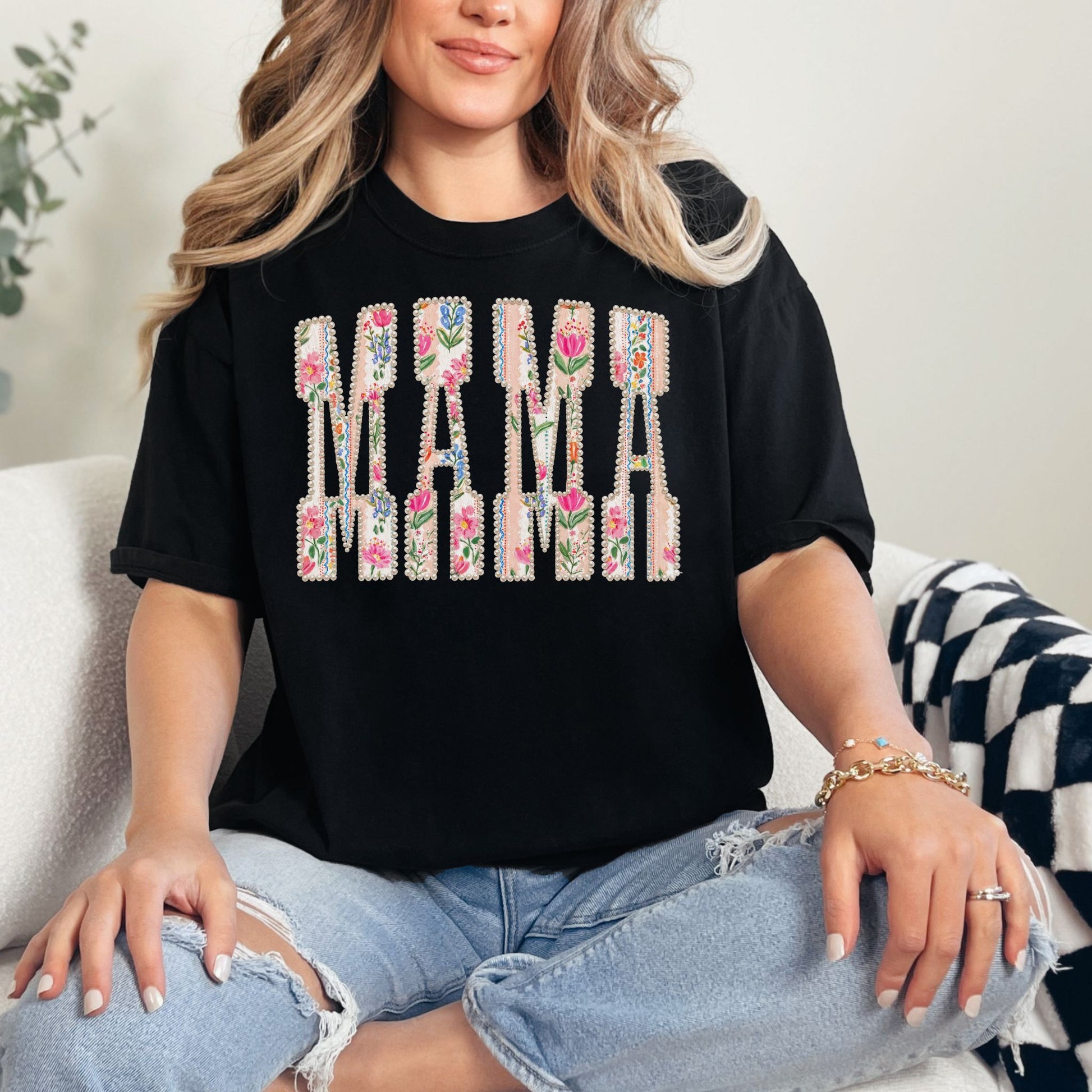 “Pearl Floral Mama" graphic on black (black) t-shirt.