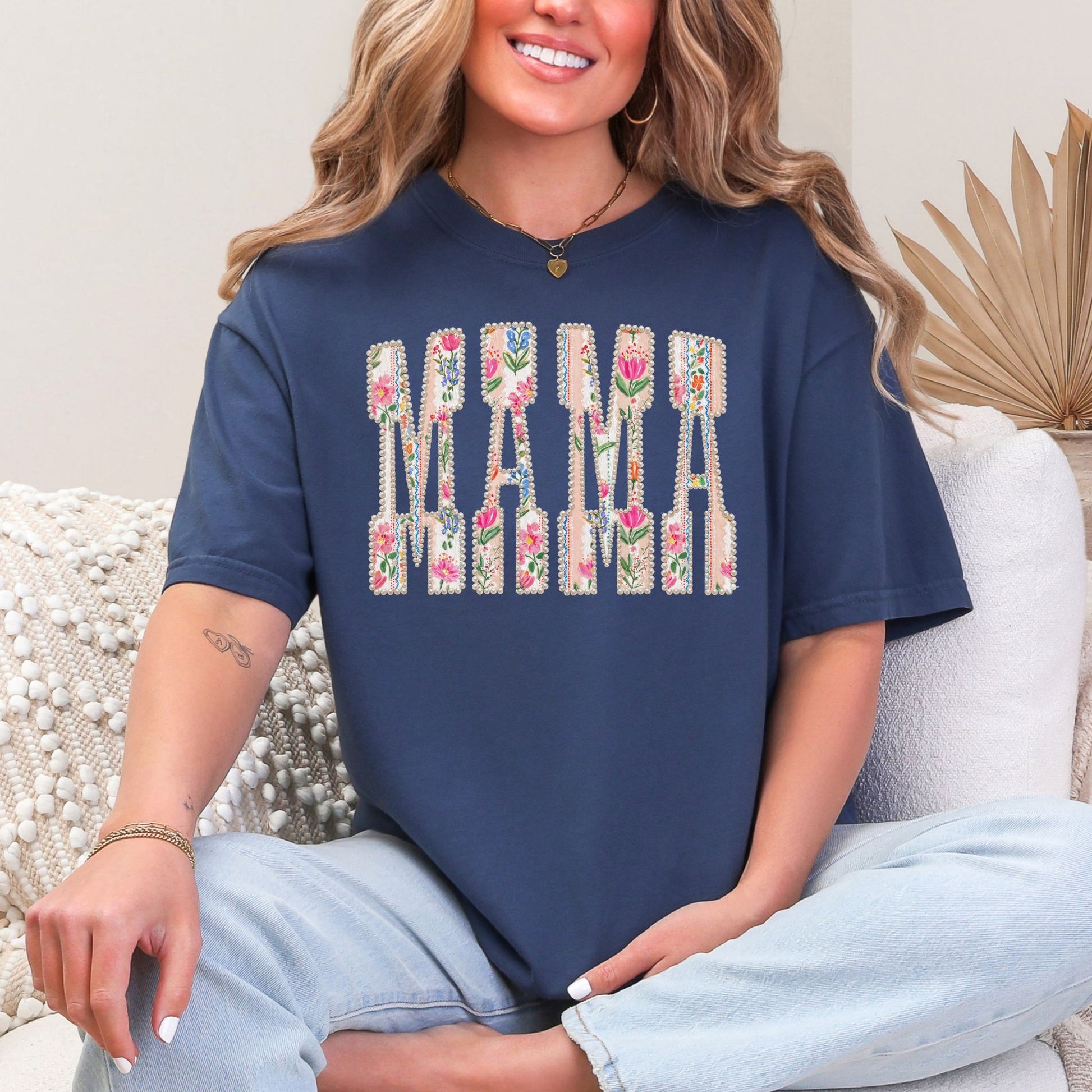 “Pearl Floral Mama" graphic on navy blue (navy) t-shirt.