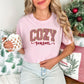 "Peppermint Cozy Season Christmas" graphic on soft pink (blossom) Comfort Colors 1717 T-Shirt.