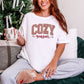 "Peppermint Cozy Season Christmas" graphic on a white Comfort Colors 1717 T-Shirt.