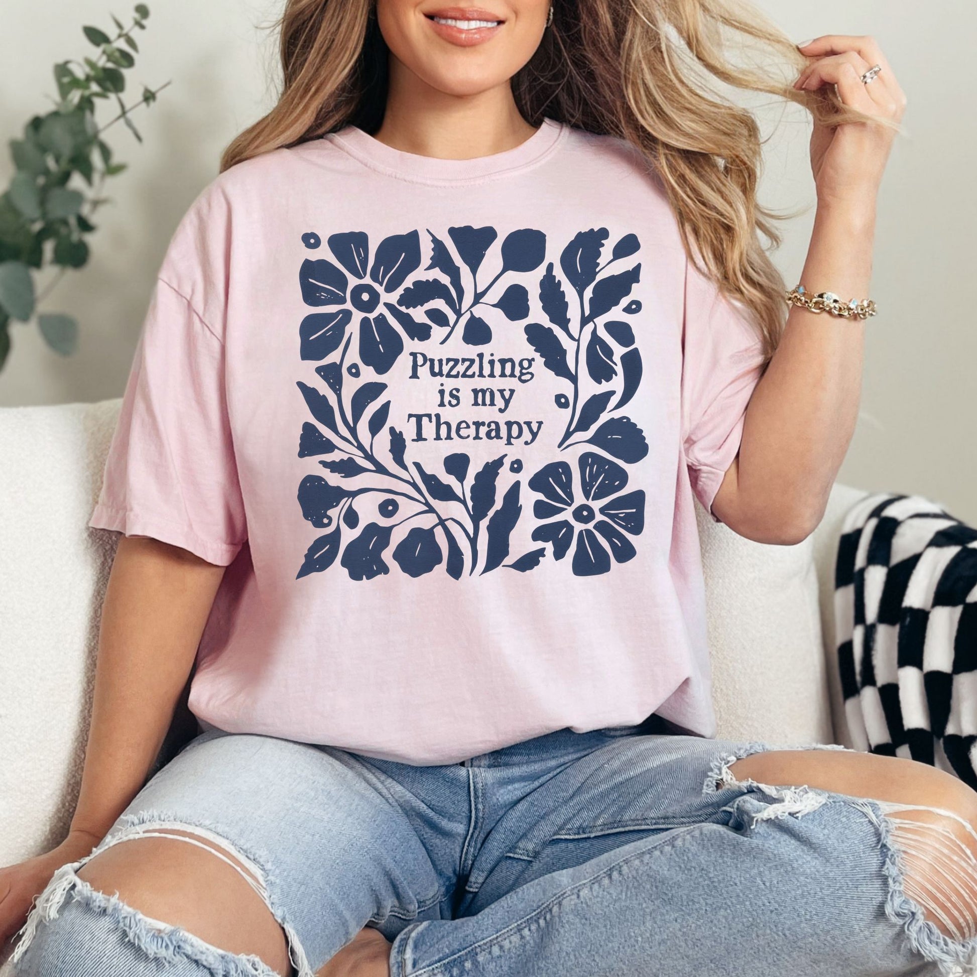 “Puzzling is my therapy" graphic on soft pink (blossom) t-shirt.
