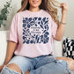 “Puzzling is my therapy" graphic on soft pink (blossom) t-shirt.