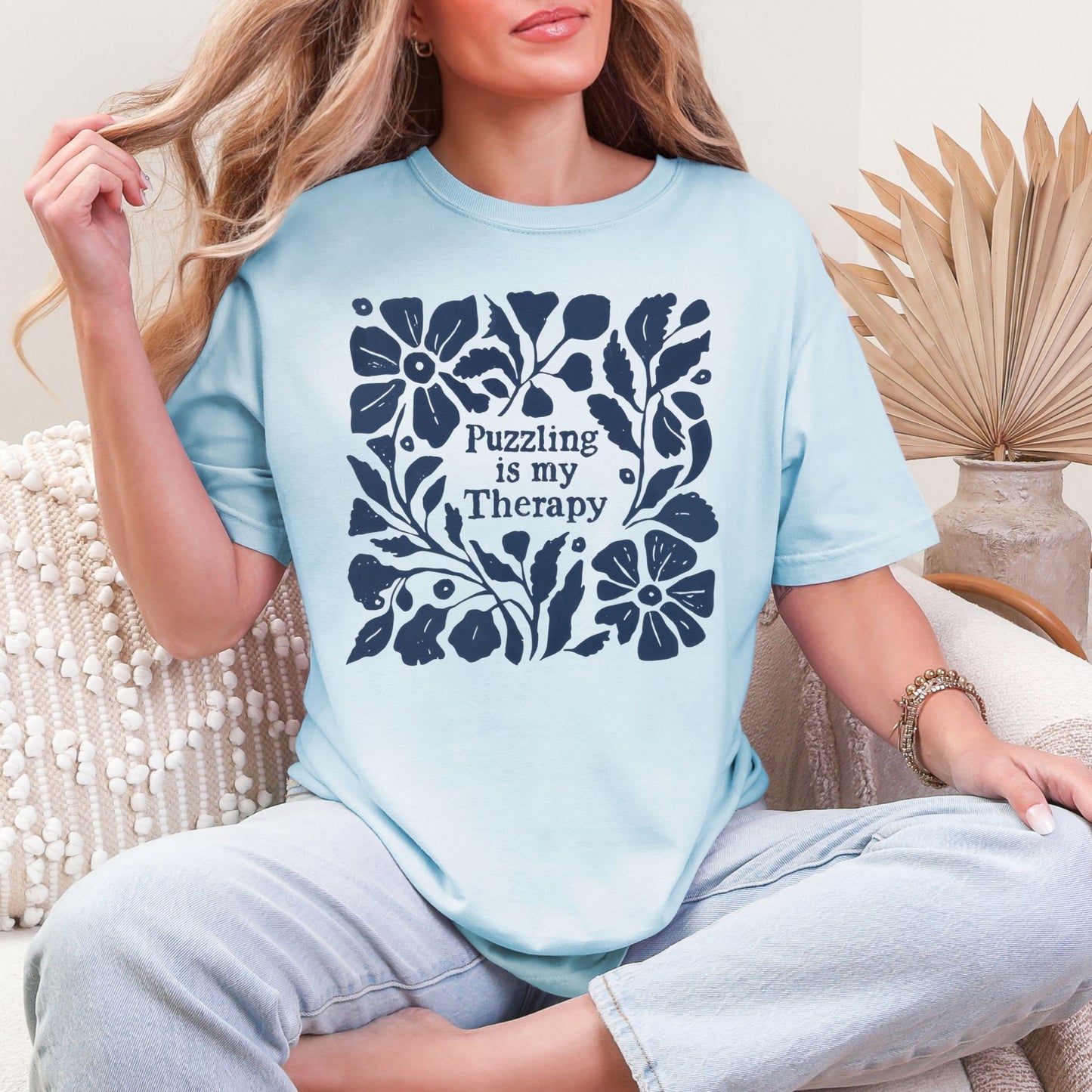 “Puzzling is my therapy" graphic on soft medium blue (chambray) t-shirt.