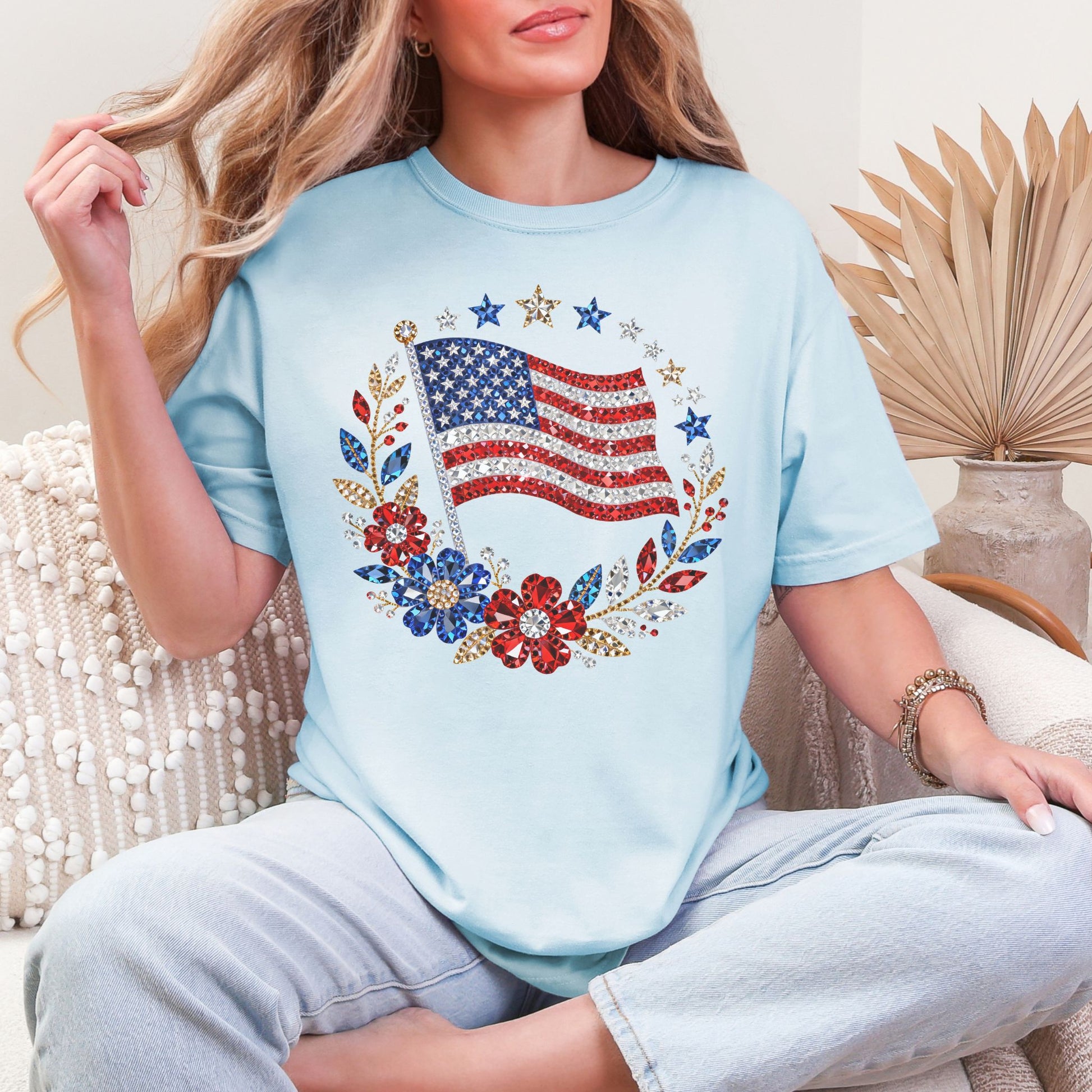 "Faux Rhinestone American Flag Diamond Art" graphic on a soft medium blue (chambray) T-Shirt.