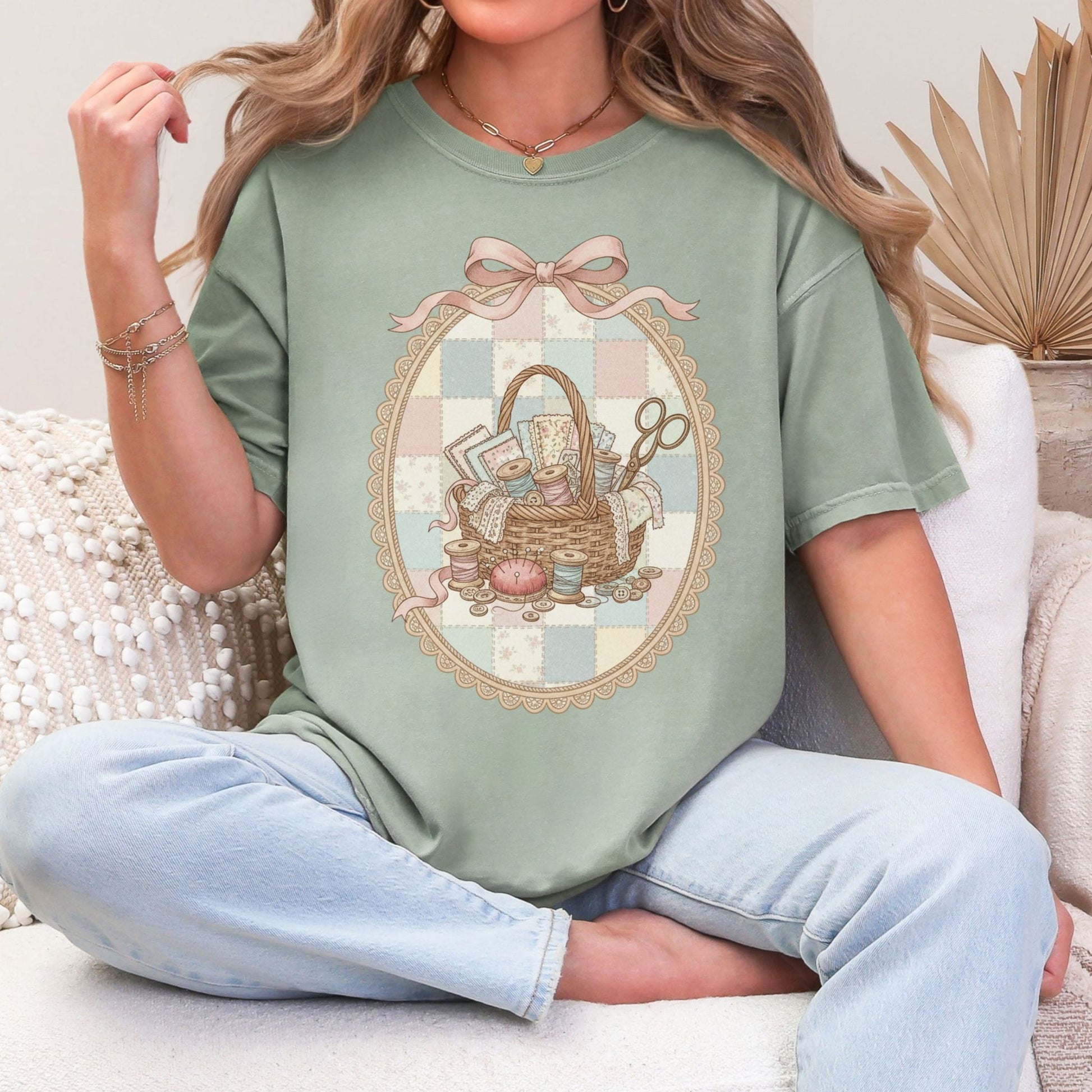 "Sewing basket vintage coquette" graphic on muted teal-green (bay) T-Shirt. 