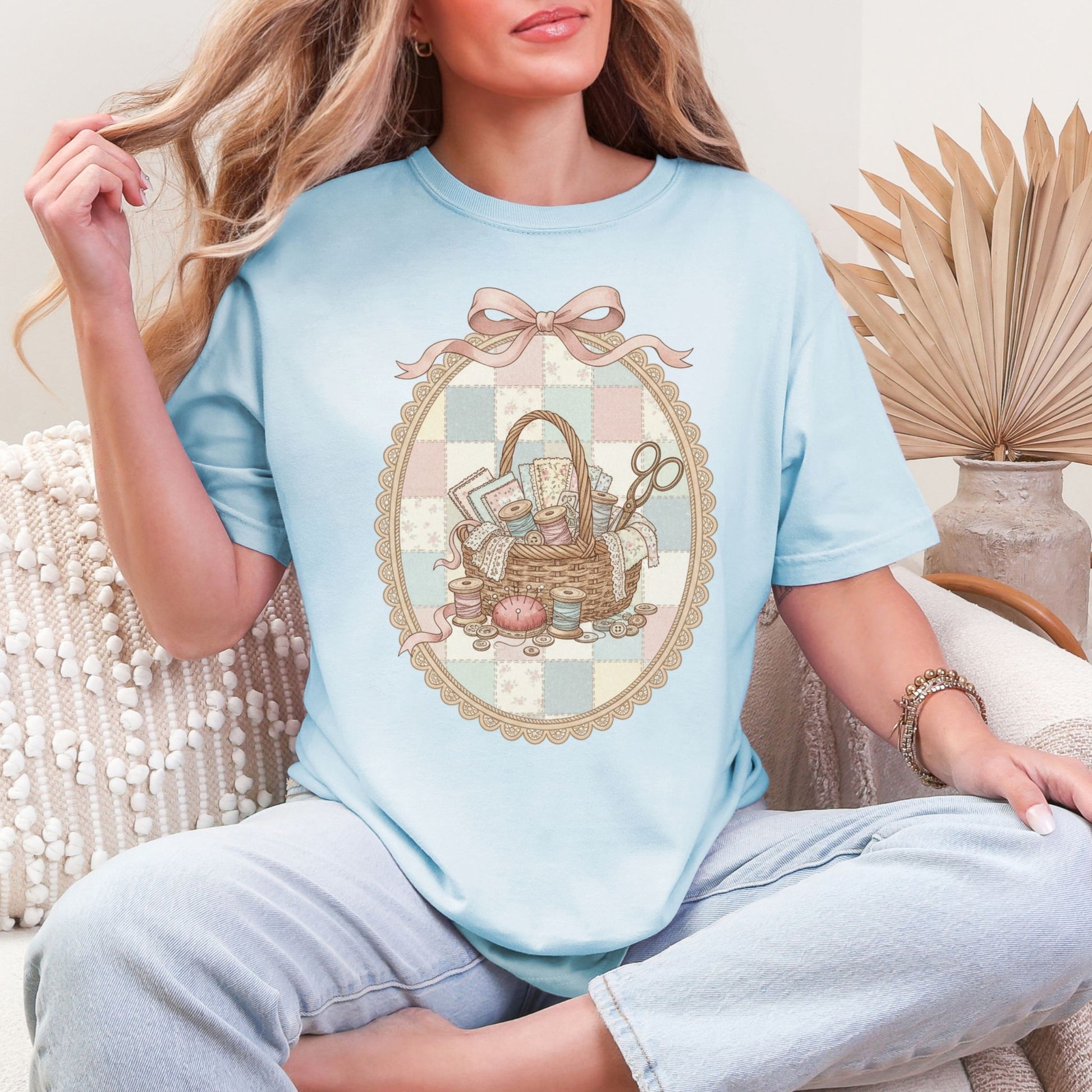 "Sewing basket vintage coquette" graphic on soft medium blue (chambray) T-Shirt. 