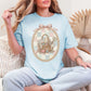 "Sewing basket vintage coquette" graphic on soft medium blue (chambray) T-Shirt. 