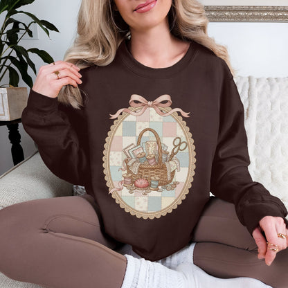 "Sewing Basket Vintage Coquette" graphic on deep brown (dark chocolate) Sweatshirt.