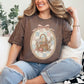 "Sewing basket vintage coquette" graphic on rich brown (espresso) T-Shirt. 
