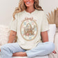 "Sewing basket vintage coquette" graphic on soft off-white (ivory) T-Shirt. 