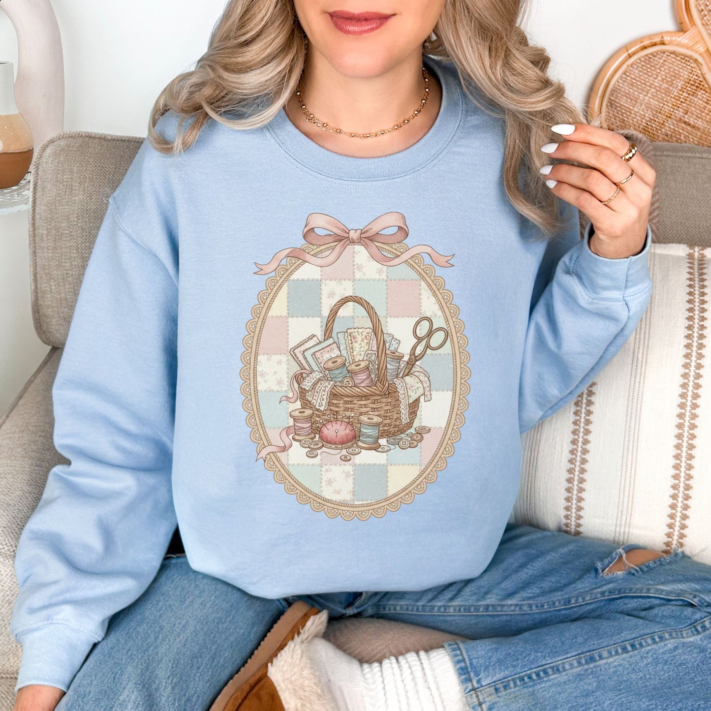 "Sewing Basket Vintage Coquette" graphic on pale blue (light blue) Sweatshirt.