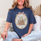 "Sewing basket vintage coquette" graphic on a deep navy blue (navy) T-Shirt. 