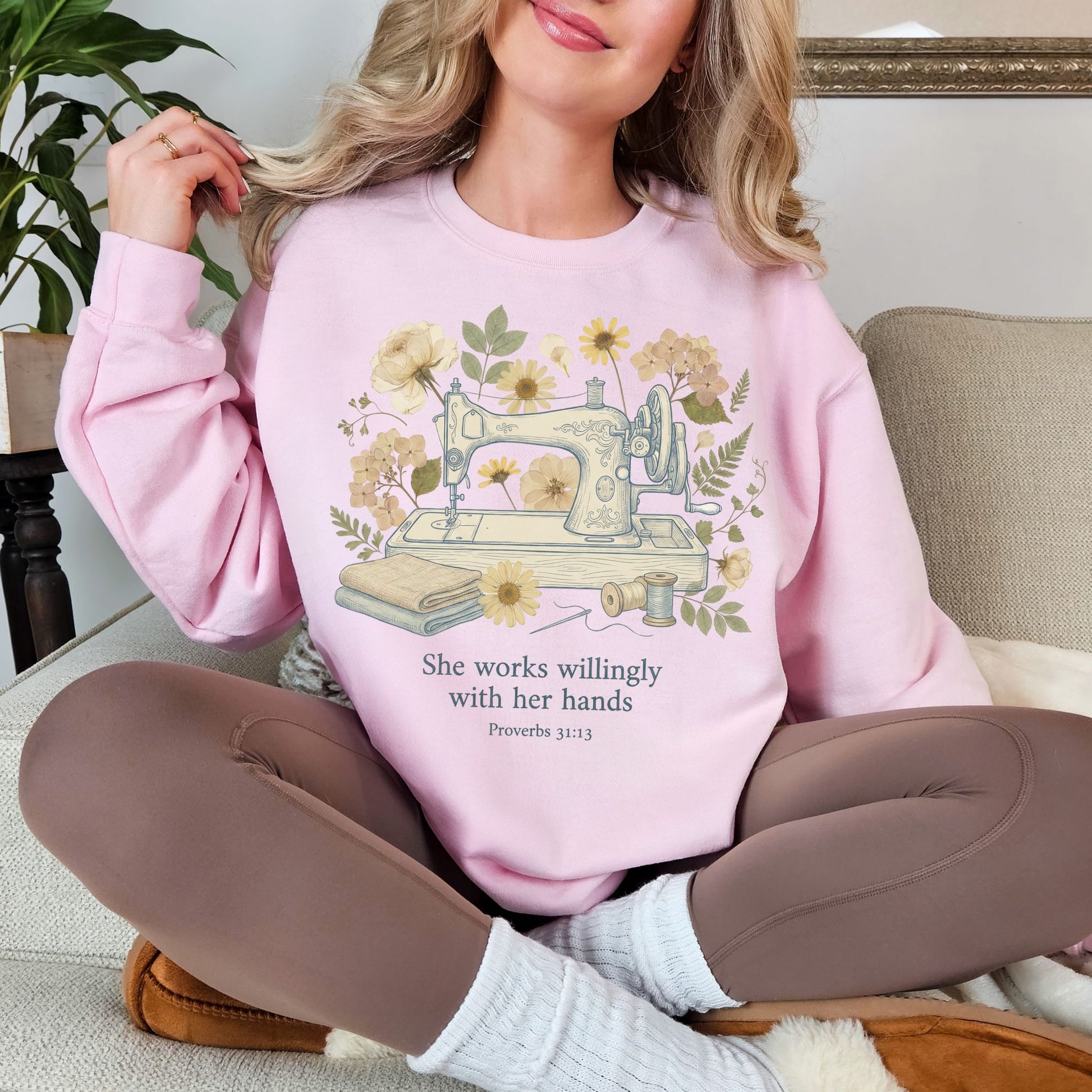 "Sewing she works willingly" graphic on soft pale pink (light pink) sweatshirt.