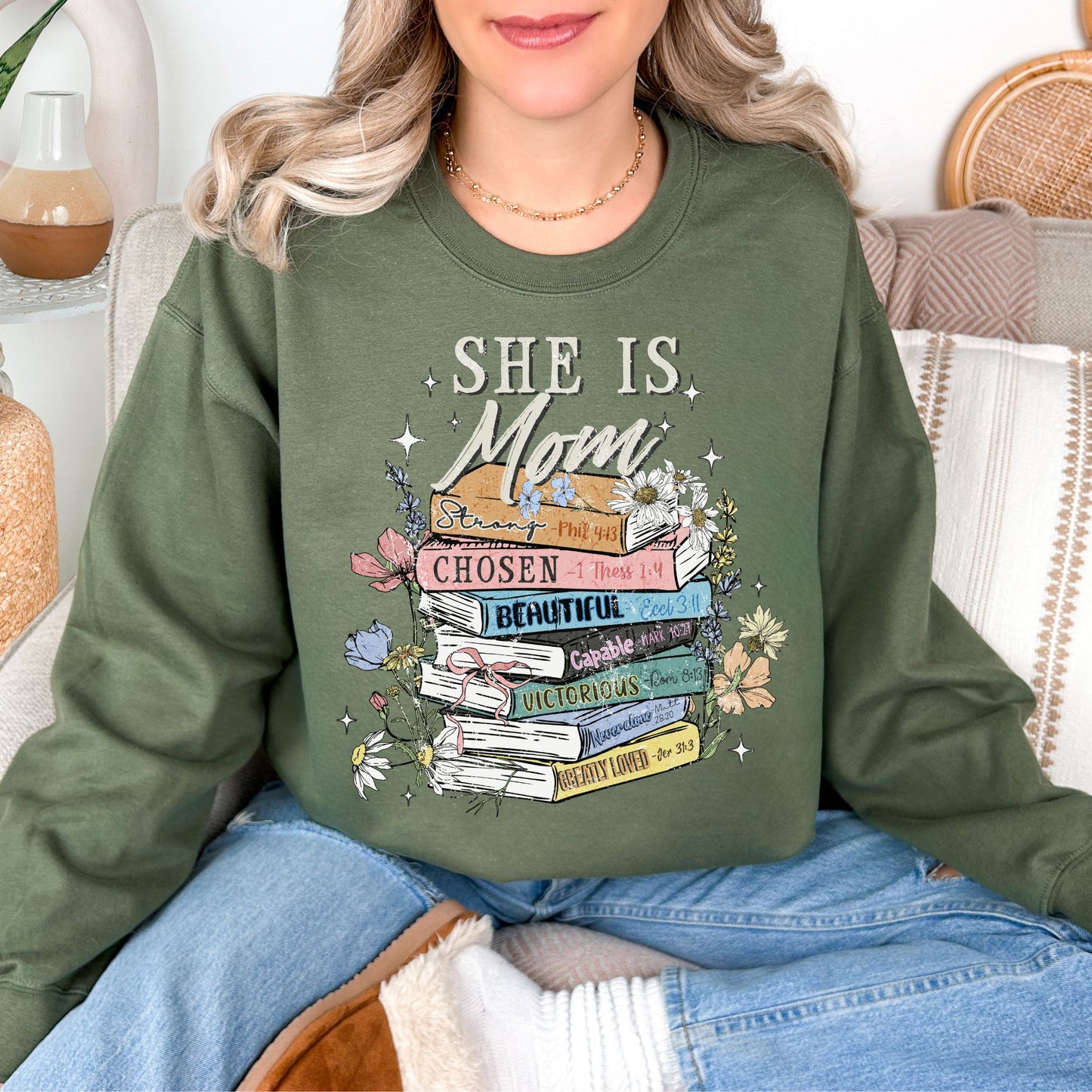 "She is mom" graphic on muted olive green (military green) Sweatshirt.