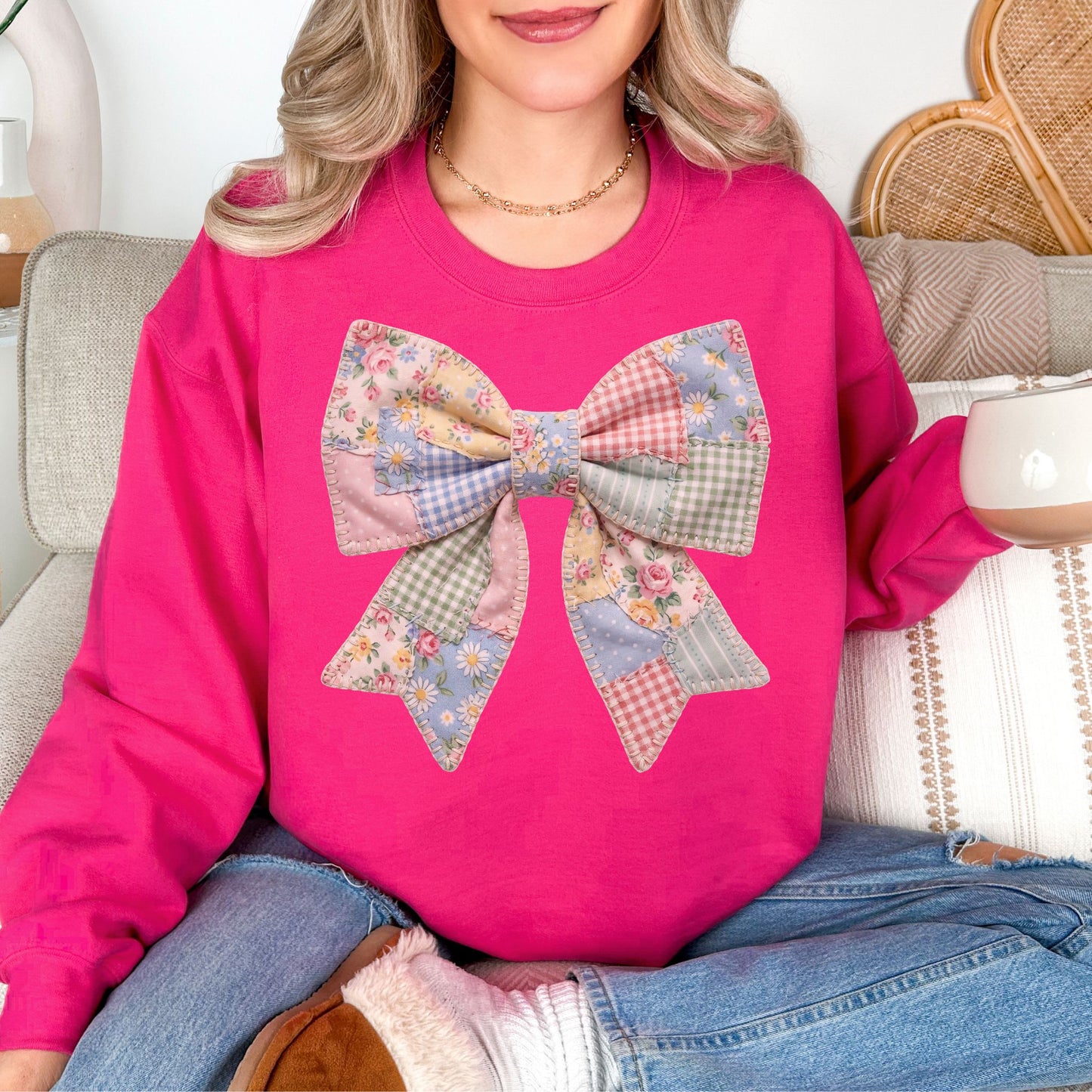 “Spring Faux Patchwork Bow" graphic on bright pink (heliconia) sweatshirt.