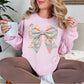 “Spring Faux Patchwork Bow" graphic on soft pale pink (light pink) sweatshirt.