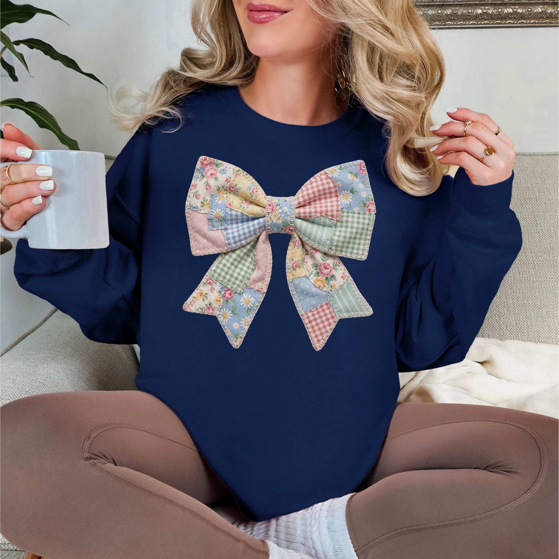 “Spring Faux Patchwork Bow" graphic on deep navy blue (navy) sweatshirt.