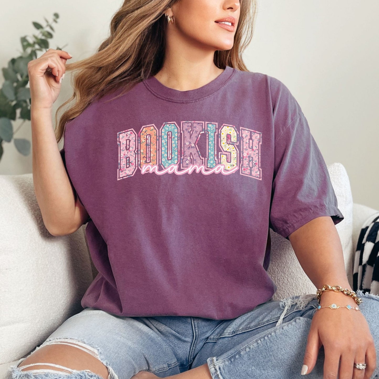 “Spring Floral Bookish Mama" graphic on deep berry pink (berry) t-shirt.