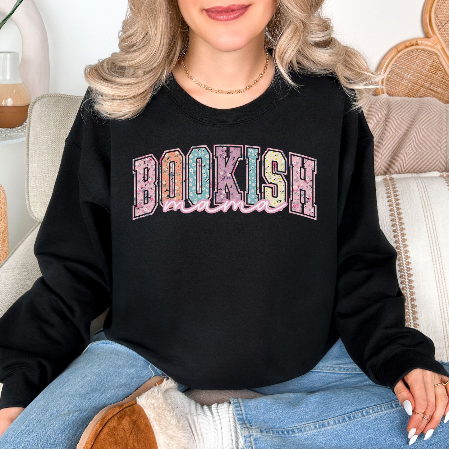 “Spring Floral Bookish Mama" graphic on a very black (black) Sweatshirt.