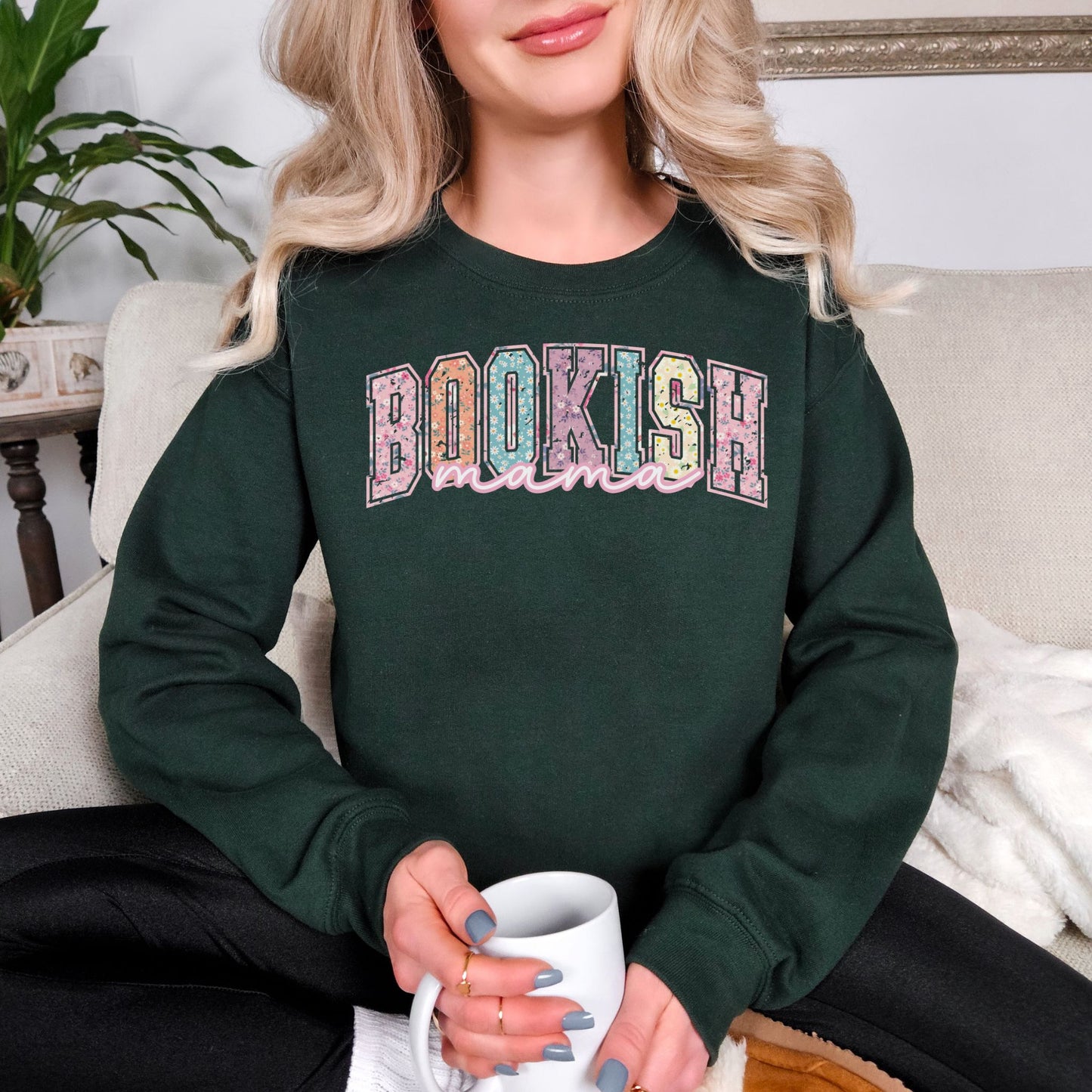 “Spring Floral Bookish Mama" graphic on a dark green (forest green) Sweatshirt.