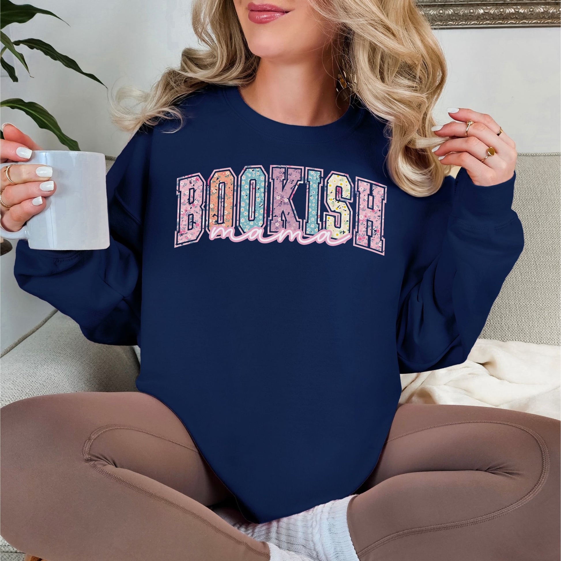 “Spring Floral Bookish Mama" graphic on dark blue (navy) Sweatshirt.
