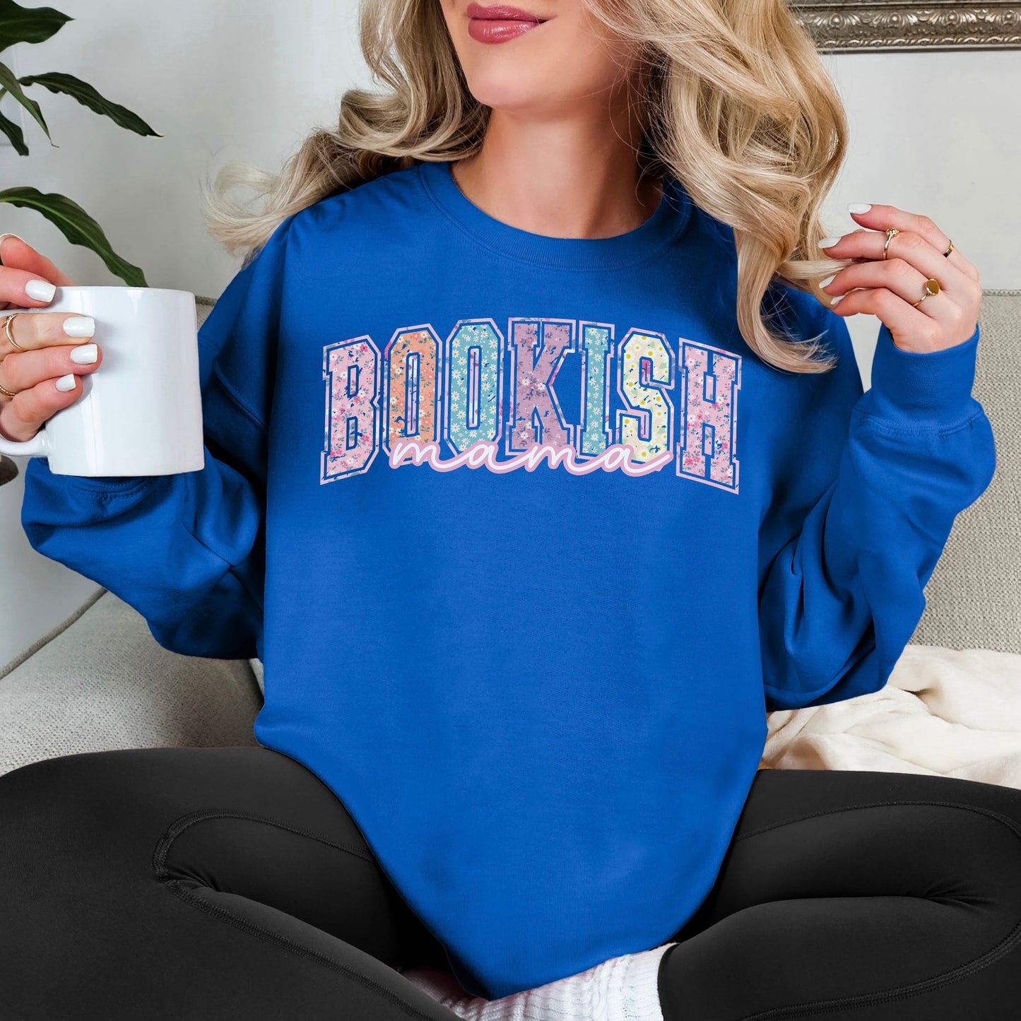 “Spring Floral Bookish Mama" graphic on a bright medium blue (royal) Sweatshirt.