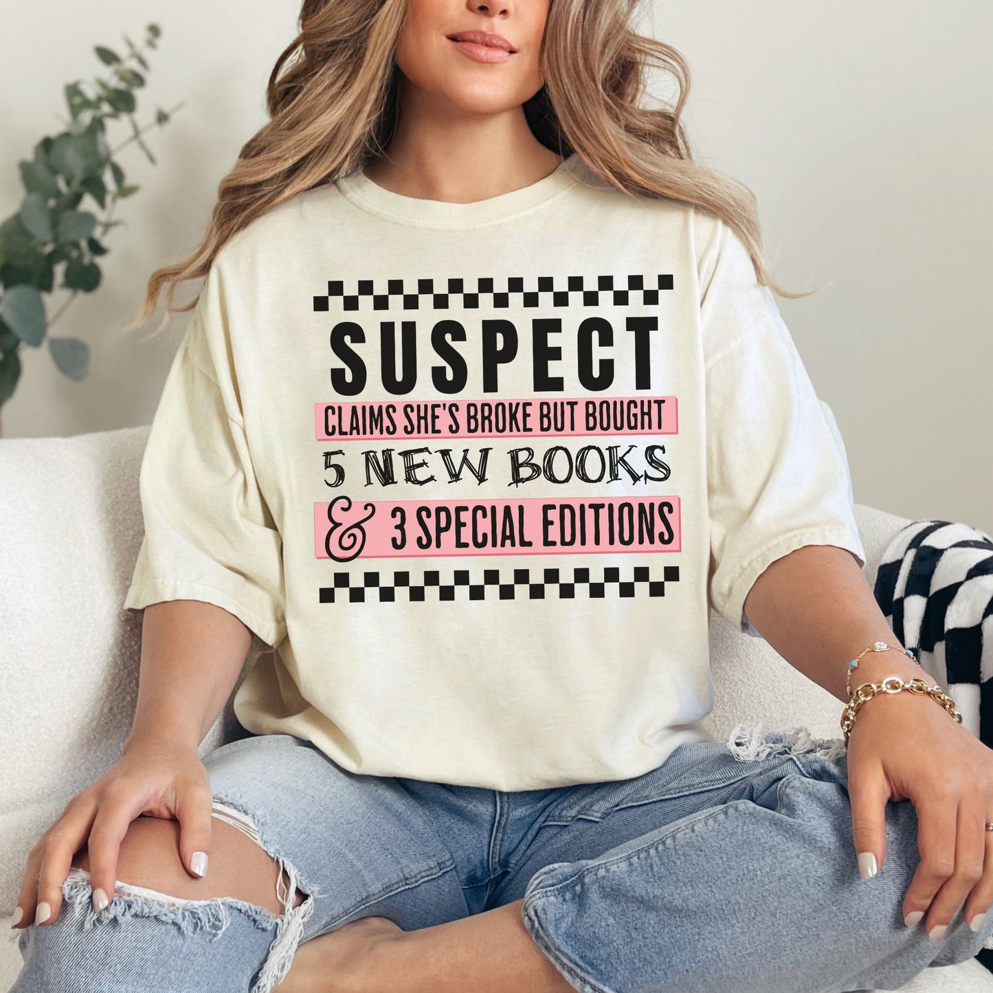 "Suspect claims she's broke" in soft off-white (ivory)