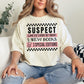 "Suspect claims she's broke" in soft off-white (ivory)