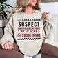 "Suspect Claims She's Broke" graphic on very light gray (ash) Sweatshirt