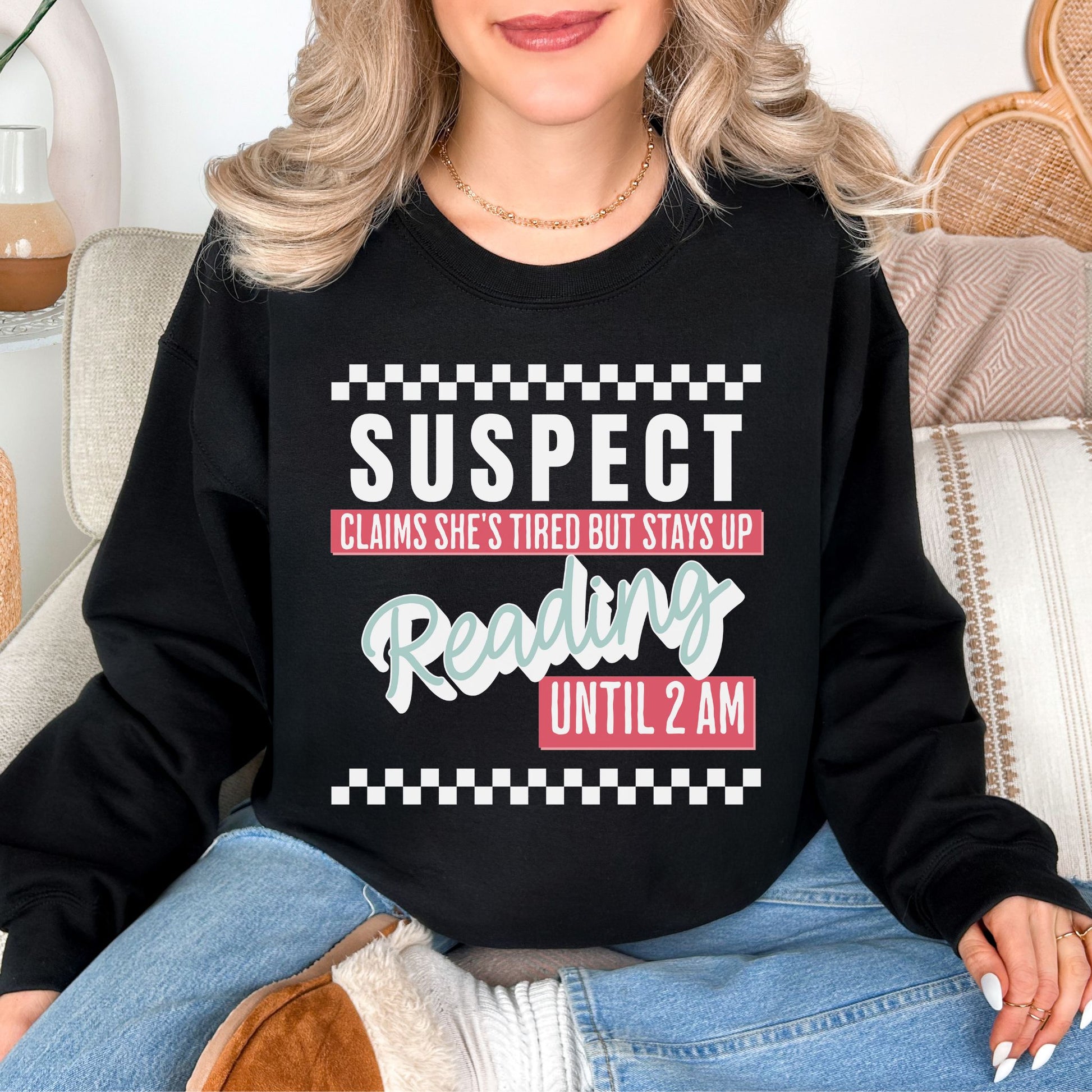 “Suspect claims she's tired" graphic on deep black (black) Sweatshirt