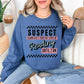 “Suspect claims she's tired" graphic on rich medium-dark blue (indigo blue) Sweatshirt