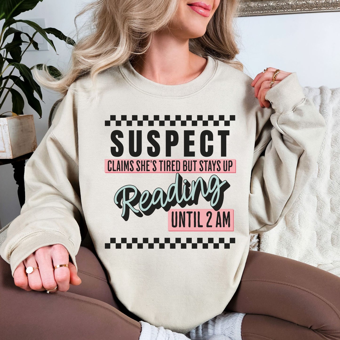 “Suspect claims she's tired" graphic on light warm beige (sand) Sweatshirt