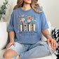 "There's no such thing as too many books" graphic on muted denim blue (blue jean) T-shirt.