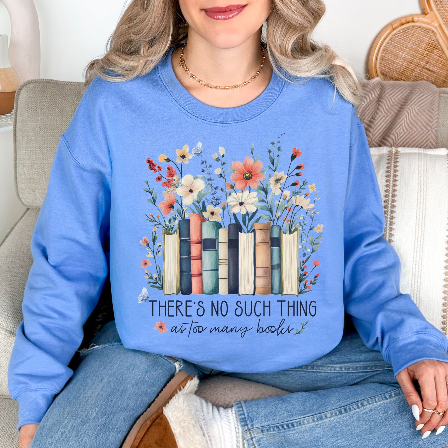 “There's no such thing as too many books" graphic on soft sky blue (carolina blue) Sweatshirt