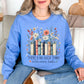 “There's no such thing as too many books" graphic on soft sky blue (carolina blue) Sweatshirt
