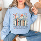 “There's no such thing as too many books" graphic on pale soft blue (light blue) Sweatshirt