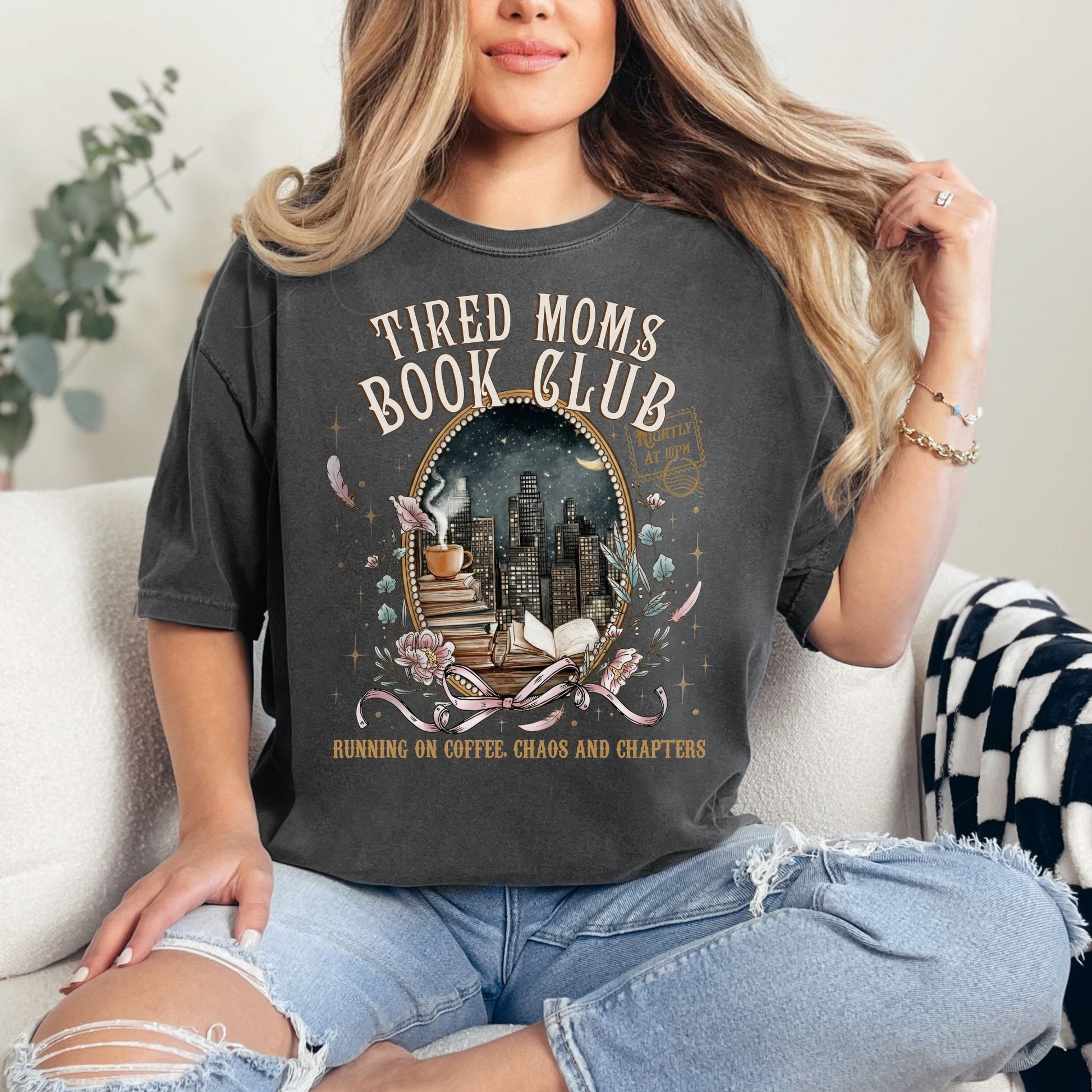 "Tired Moms Book Club" graphic on dark charcoal gray (pepper) t-shirt.
