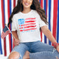 "Coquette Watercolor American Flag" graphic on a white T-shirt.